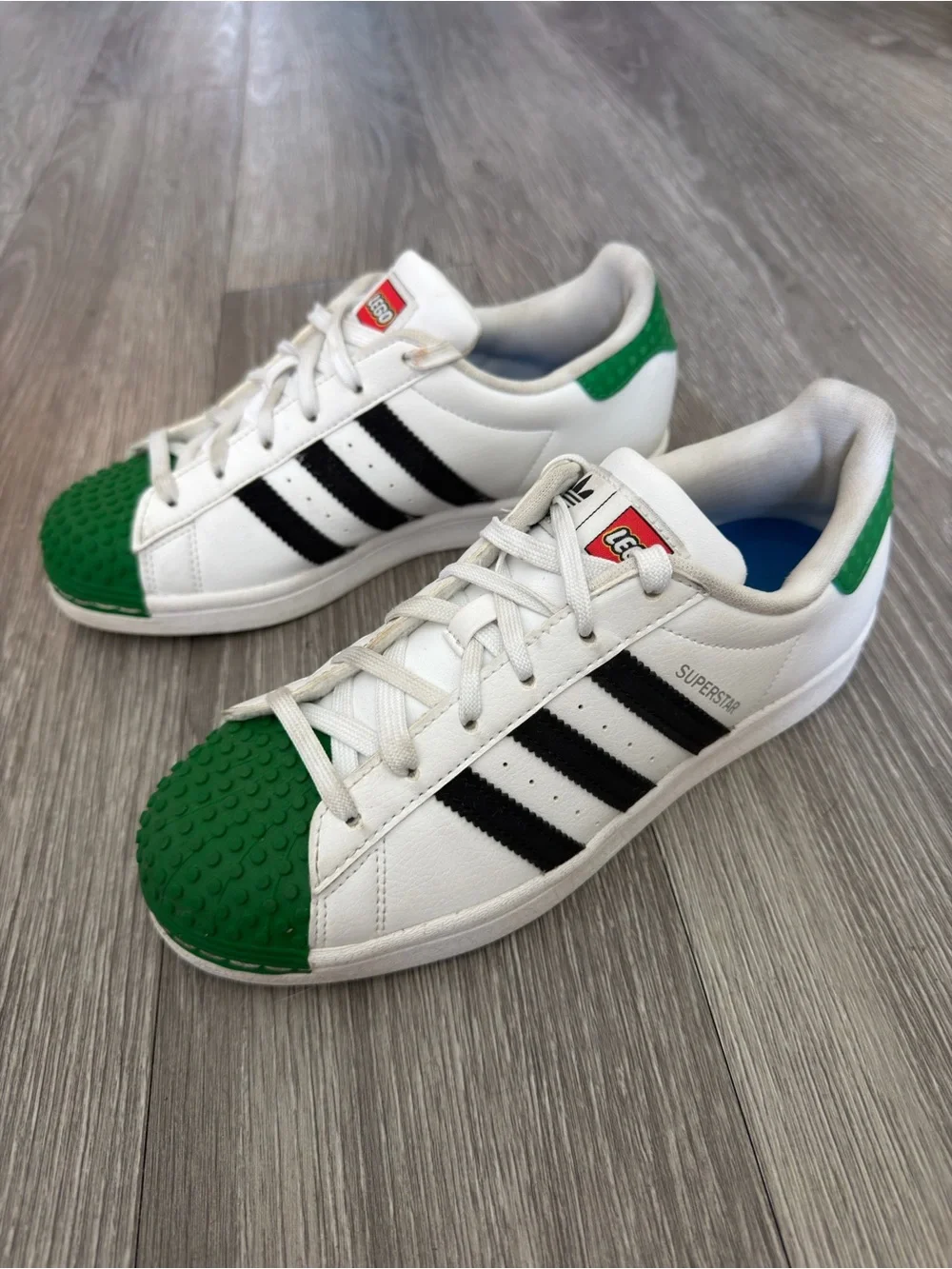 Adidas Men’s Lego’s Edition Superstar Sneakers in White, Black & Green